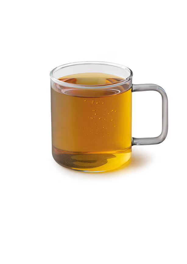 En Teavana™ Harmonic Mint Tea i et glaskrus